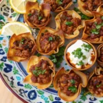 Golden brown Taco Ranch Bites on a white platter.