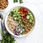 Colorful Mediterranean Chickpea Bowl with crispy chickpeas and fresh vegetables.