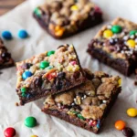 Easy monster cookie fudgy brownies – double layer brownies with fudgy chocolate base and chewy monster cookie topping