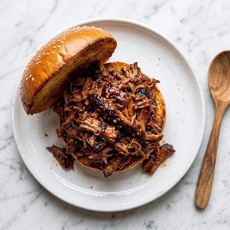 Instant Pot BBQ Pulled Pork Sandwiches (3 Ingredients) Recipe - Instant Pot BBQ Pulled Pork Sandwiches (3 Ingredients) Recipe served in a white bowl overhead view